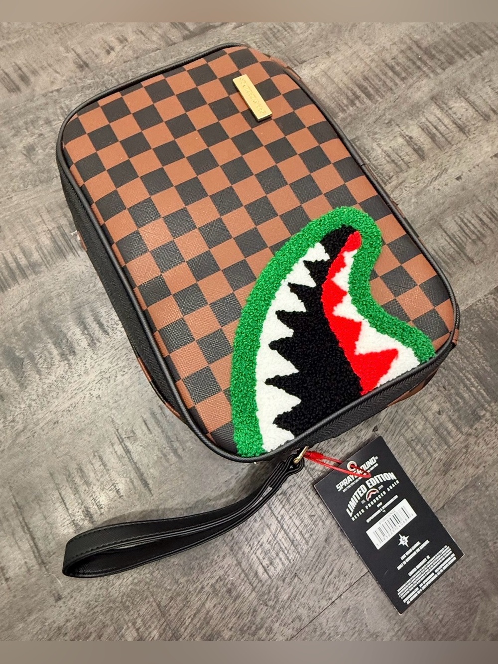 Sprayground Brown Checkered Wristlet with Multicolor Shark Patch